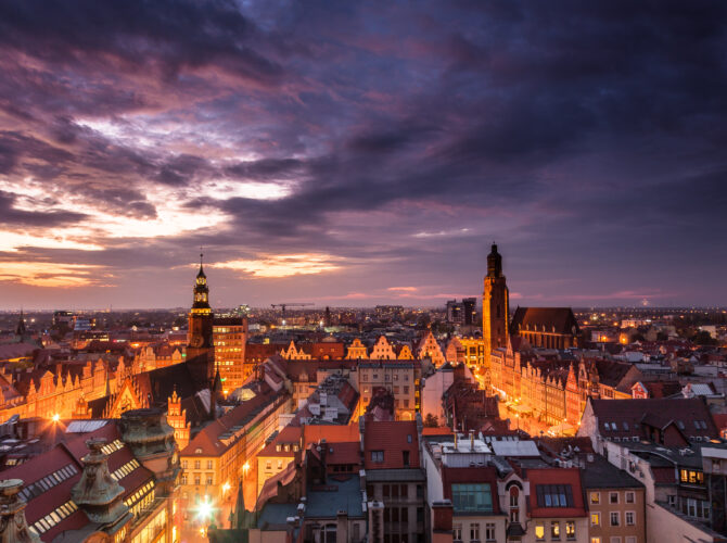 Illuminated city skyline at night, Wroclaw, Poland, Europe.